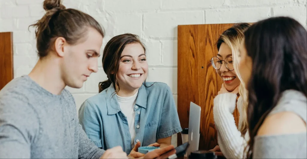 Half of Young UK Investors Plan To Invest as FCA Approves Crypto ETNs From October 8 young people around a computer